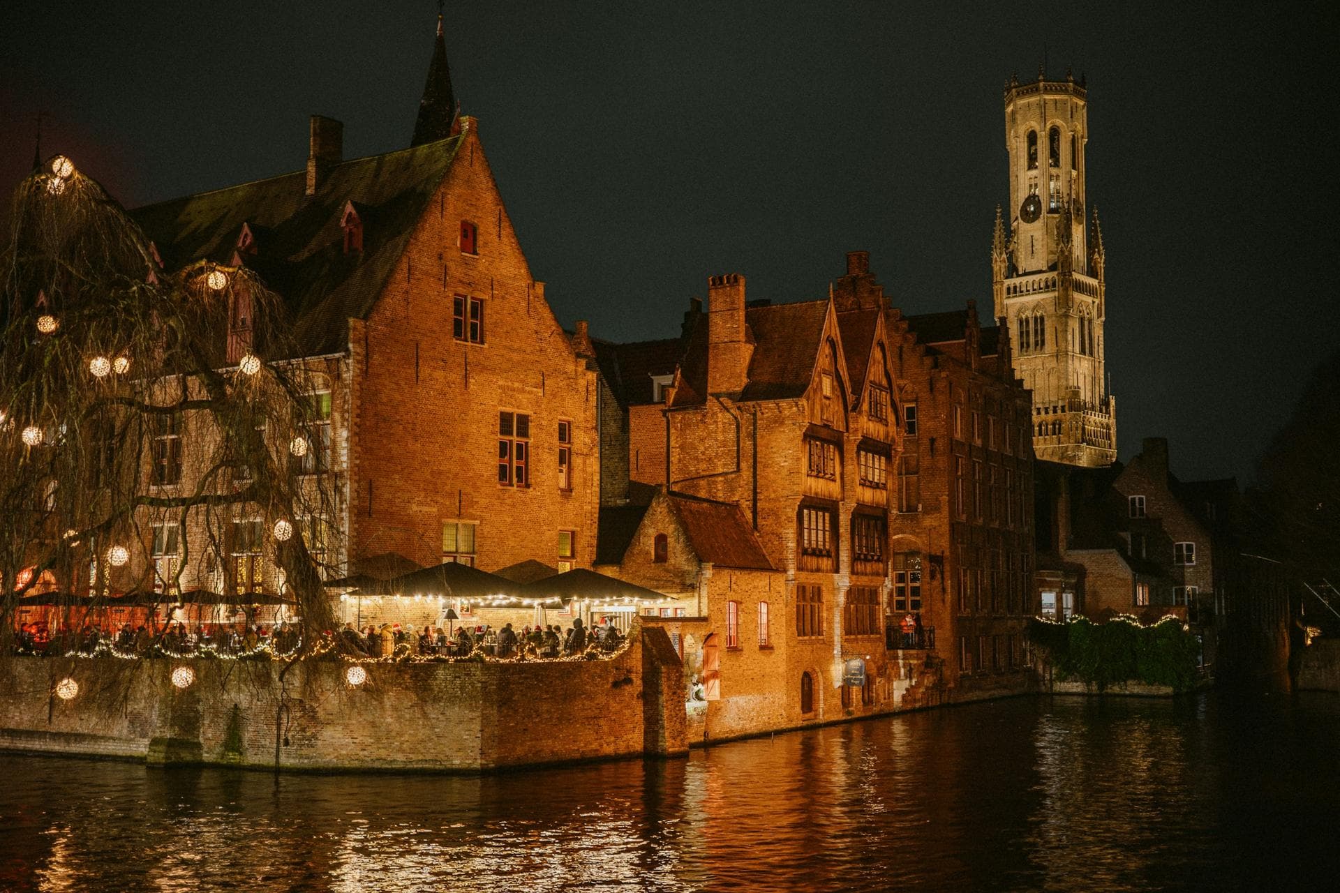 The Rozenhoedkaai with the Belfry in Bruges at night